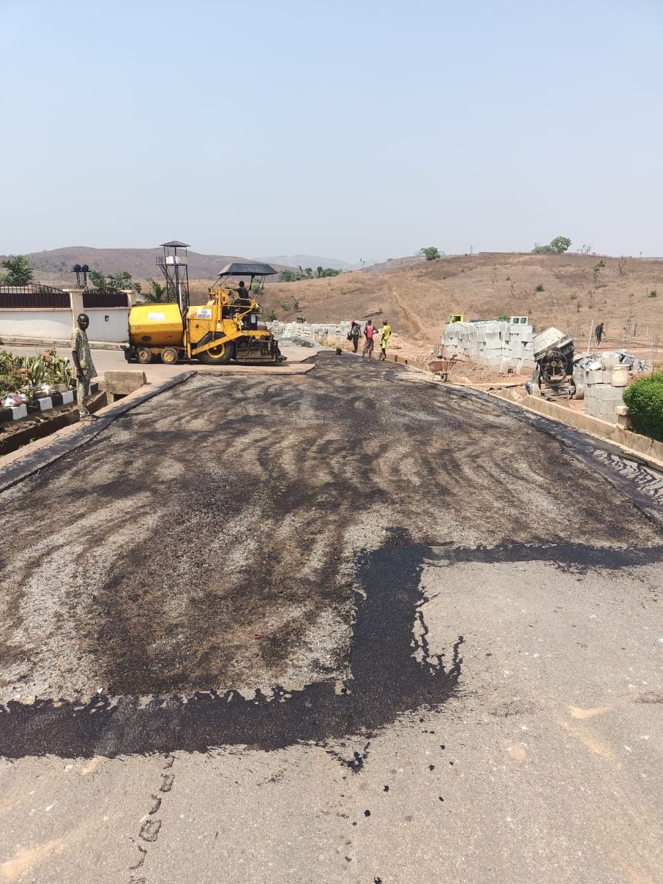 Asphalt patch repair works at NAF Valley Estate, Asokoro