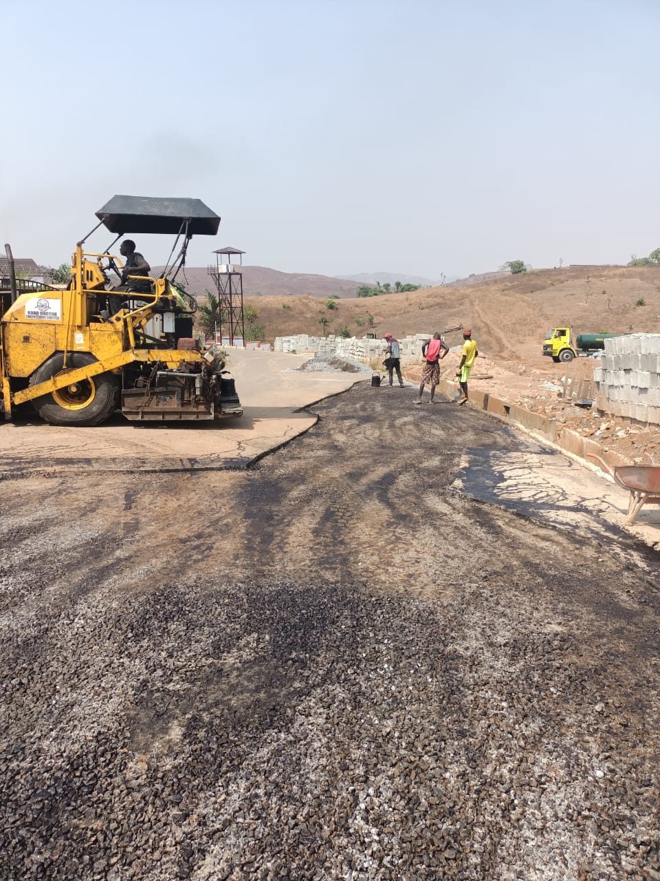 Road roller and paving works at NAF Valley Estate, Asokoro